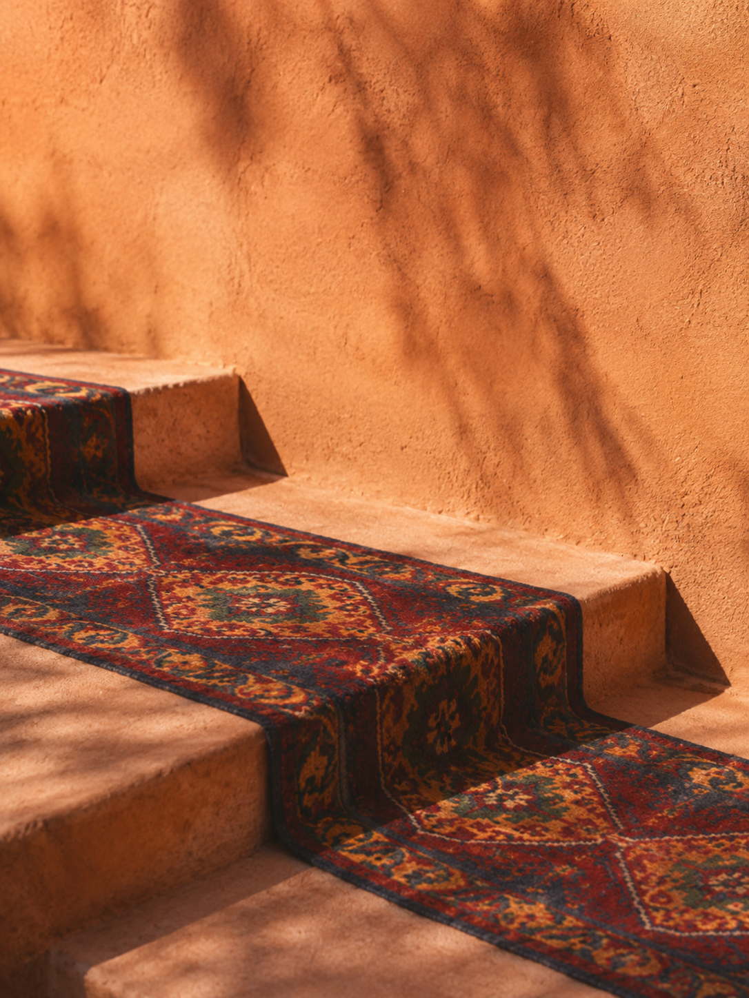 Steps in the courtyard laid with a heritage rug